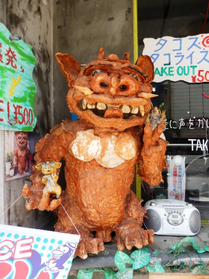 This shisa holding a pair of pigs can be found outside a take-away on Naha's Kokusai Street. Okinawans love pork almost as much as they love shisa, and you'll find plenty of pig-themed souvenirs here.