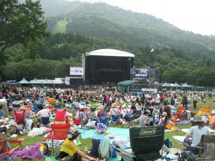People gathered on a field waiting for Fuji Rock festival to start