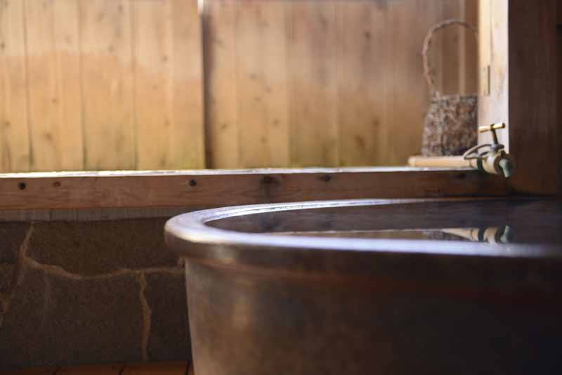 Outdoor hot spring bath at a Japanese inn