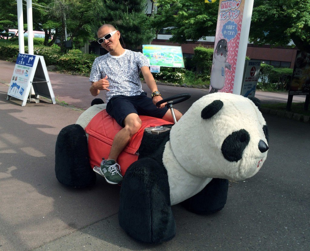 Mark Fujishige riding the panda InsideJapan Tours