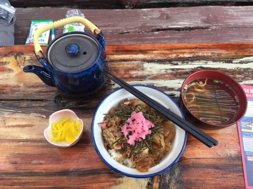 Gyudon (beef on rice), pickles and some miso soup. Highly recommended. Also the pizza and the mushroom tea are great (yes, mushroom tea). I seriously can't stress how important it is to load up, there isn`t any better food on the mountain.