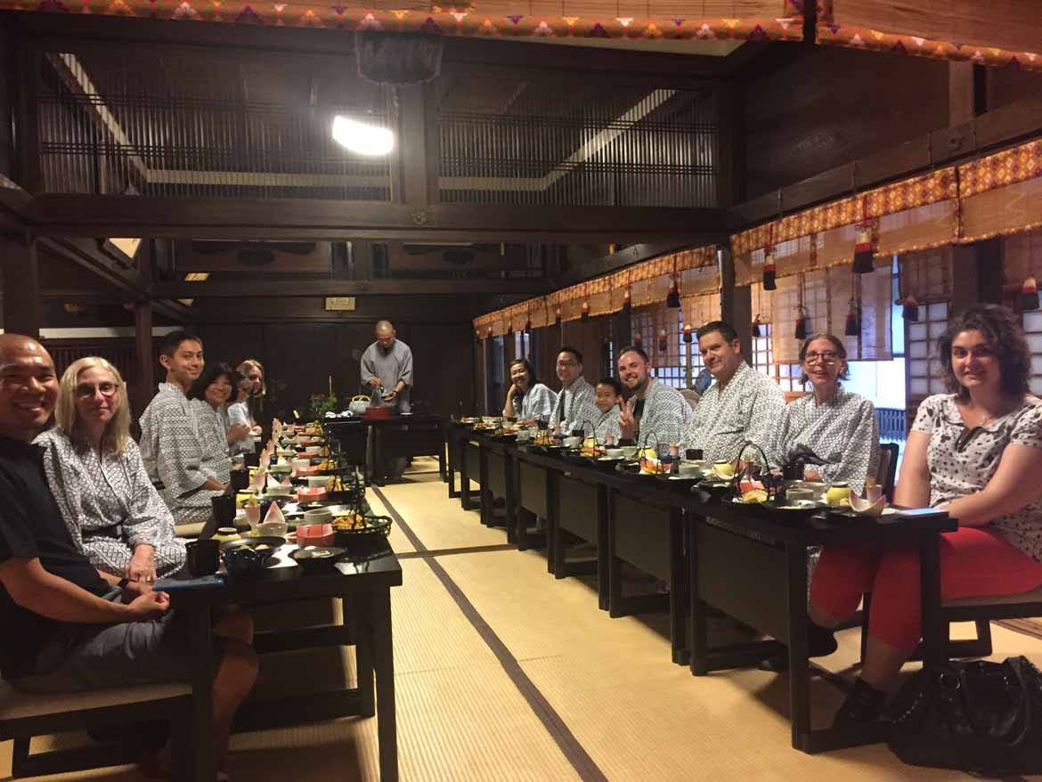 Simona and her group tour having a traditional dinner at their ryokan inn